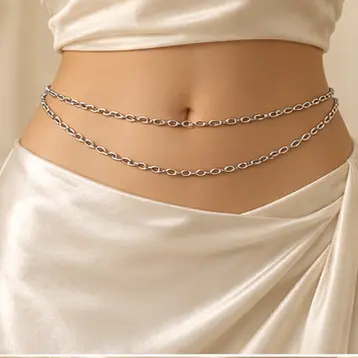 Marée Double-Layer Waist Chain worn over an ivory dress